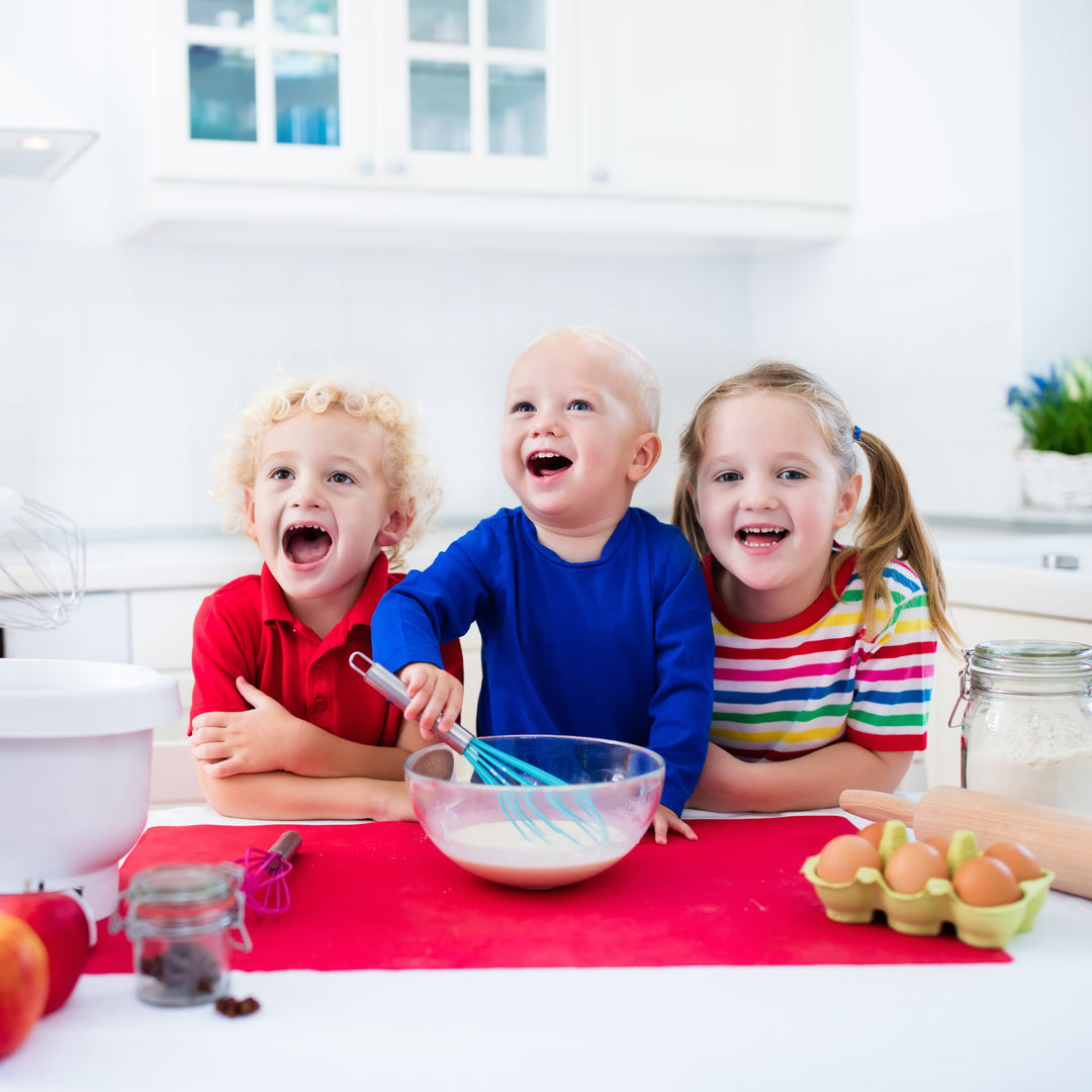 Picture of children cooking and smiling