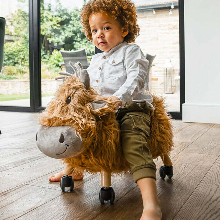 Little Bird Told Me Hubert Highland Cow Ride On Toy